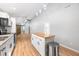 Open-concept kitchen features stainless steel appliances, wood countertops, and island with seating at 150 W Jo Jo Ln, Nineveh, IN 46164