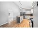 Open kitchen featuring white cabinets, stainless steel appliances, and a butcher block island at 150 W Jo Jo Ln, Nineveh, IN 46164
