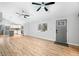 Open-concept living room with wood-look floors, vaulted ceilings, and abundant natural light at 150 W Jo Jo Ln, Nineveh, IN 46164