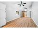 Bright living room with light-colored walls, wood floors, and a barn door at 150 W Jo Jo Ln, Nineveh, IN 46164