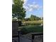 Picturesque backyard featuring a tranquil pond and a partial rainbow, perfect for relaxation and enjoying nature's beauty at 15179 Kampen Cir, Carmel, IN 46033