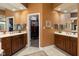 Spacious bathroom with dual vanities, and sinks, and access to walk-in closet at 15179 Kampen Cir, Carmel, IN 46033