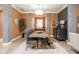 Stylish dining room with a large table, modern decor, and natural light at 15179 Kampen Cir, Carmel, IN 46033