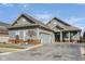 Well-maintained single-Gathering home with attached garage, blue siding, and brick accents at 15179 Kampen Cir, Carmel, IN 46033