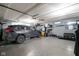 Spacious garage with epoxy flooring, car, and storage shelving for organization and functionality at 15179 Kampen Cir, Carmel, IN 46033