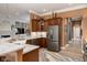 Well-equipped kitchen featuring granite countertops, stainless steel appliances, and custom cabinetry at 15179 Kampen Cir, Carmel, IN 46033