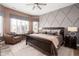 Serene main bedroom features an accent wall, neutral palette, and shuttered windows at 15179 Kampen Cir, Carmel, IN 46033