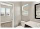 Bathroom with a toilet and window at 1624 Prospect St, Indianapolis, IN 46203