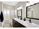 Bathroom with a double sink vanity and wood look flooring at 1624 Prospect St, Indianapolis, IN 46203