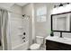 Bathroom featuring a shower with a white tub, vanity, and modern fixtures at 1624 Prospect St, Indianapolis, IN 46203