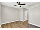 Bright bedroom featuring modern wood floors, ceiling fan and white trim at 1624 Prospect St, Indianapolis, IN 46203