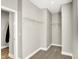 Walk-in closet with carpet flooring and shelving at 1624 Prospect St, Indianapolis, IN 46203