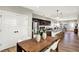 Dining area features a wooden table, modern chairs, white doors and an adjacent kitchen space with a breakfast bar at 1624 Prospect St, Indianapolis, IN 46203