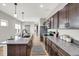 Bright kitchen featuring granite countertops, stainless steel appliances, and an island with bar seating at 1624 Prospect St, Indianapolis, IN 46203