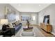 Spacious living room with modern decor, hardwood floors, and abundant natural light at 1624 Prospect St, Indianapolis, IN 46203
