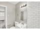 Bathroom features modern vanity with subway tile backsplash, and a neutral wall color at 1651 Lawton Ave, Indianapolis, IN 46203