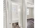 View of bathroom with tiled shower/tub combination, neutrally decorated, and wood look floors at 1651 Lawton Ave, Indianapolis, IN 46203