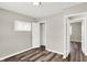 Bedroom with new vinyl plank flooring, a standard closet and two doorways at 1651 Lawton Ave, Indianapolis, IN 46203