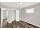 Cozy bedroom showcasing hardwood floors, ample closet space, and a calming ambiance at 1651 Lawton Ave, Indianapolis, IN 46203