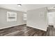 Living room featuring wood-look floors, neutral walls and a view of the bathroom at 1651 Lawton Ave, Indianapolis, IN 46203