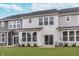 Townhome backyard featuring a patio and green lawn at 18712 Moray St, Westfield, IN 46074
