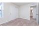 Bedroom with neutral carpet, sliding closet, and en-suite bathroom entrance at 18712 Moray St, Westfield, IN 46074