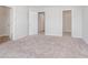 Bright bedroom featuring neutral carpet, white walls and trim, and three doors, one to closet at 18712 Moray St, Westfield, IN 46074
