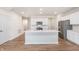 Kitchen boasts a large island with sink, stainless appliances, and white cabinets at 18712 Moray St, Westfield, IN 46074