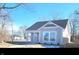 Charming single Gathering home featuring classic architecture, neutral siding, and crisp white trim at 1967 Hovey St, Indianapolis, IN 46218