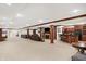 Spacious basement with home theater, bar, fireplace, and ample seating at 2110 Cheviot Ct, Greenwood, IN 46143