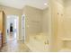 Bathroom featuring a soaking tub and a separate shower, perfect for relaxation and convenience at 2110 Cheviot Ct, Greenwood, IN 46143