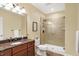 Bathroom featuring a granite countertop vanity and a tiled glass enclosed shower at 2110 Cheviot Ct, Greenwood, IN 46143