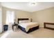 Bedroom with neutral tones, king-sized bed, and side tables with lamps at 2110 Cheviot Ct, Greenwood, IN 46143
