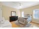 Cozy bedroom with a comfortable bed, dresser, and a window offering plenty of natural light at 2110 Cheviot Ct, Greenwood, IN 46143