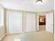 Bright bedroom featuring closet doors and a glimpse into another room at 2110 Cheviot Ct, Greenwood, IN 46143