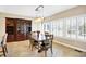 Cozy dining room with a wooden table, built-in shelves, and plenty of natural light at 2110 Cheviot Ct, Greenwood, IN 46143