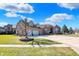 Charming brick residence with a wide driveway and a well-maintained front yard under a bright sky at 2110 Cheviot Ct, Greenwood, IN 46143