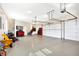 This garage has an epoxy floor with lots of room for storage, a staircase, and three garage doors at 2110 Cheviot Ct, Greenwood, IN 46143