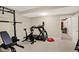 Well-equipped home gym featuring a treadmill and exercise bike, with a doorway view into another room at 2110 Cheviot Ct, Greenwood, IN 46143