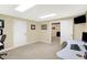 Bright home office with natural light, desk, and doorway view to another room at 2110 Cheviot Ct, Greenwood, IN 46143