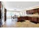Spacious kitchen with dark wood cabinets and stainless steel appliances at 2110 Cheviot Ct, Greenwood, IN 46143
