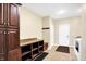 A mud room with a laundry area that includes built in cabinets, granite counters, washer and dryer at 2110 Cheviot Ct, Greenwood, IN 46143