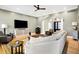 Inviting living room featuring hardwood floors, comfortable seating, and a large television at 2110 Cheviot Ct, Greenwood, IN 46143