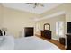 Bright main bedroom with hardwood floors, neutral paint, and large window with shutters at 2110 Cheviot Ct, Greenwood, IN 46143