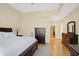 Main bedroom with hardwood floors and neutral decor with a view into another room at 2110 Cheviot Ct, Greenwood, IN 46143