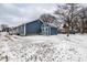 Backyard with a utility shed, chain link fence, and trees during the winter season at 2758 S Lyons Ave, Indianapolis, IN 46241
