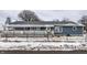 Charming single story home with a fenced yard, covered front porch, and snowy winter scenery at 2758 S Lyons Ave, Indianapolis, IN 46241