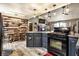 Spacious kitchen featuring stainless steel appliances, a dining table, and an island with a black countertop at 2758 S Lyons Ave, Indianapolis, IN 46241