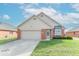 Charming single-story home with attached two-car garage, well-maintained lawn, and simple landscaping at 2979 Colony Lake E Dr, Plainfield, IN 46168