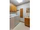 Laundry room with washer, dryer, and sink with cabinets at 2979 Colony Lake E Dr, Plainfield, IN 46168